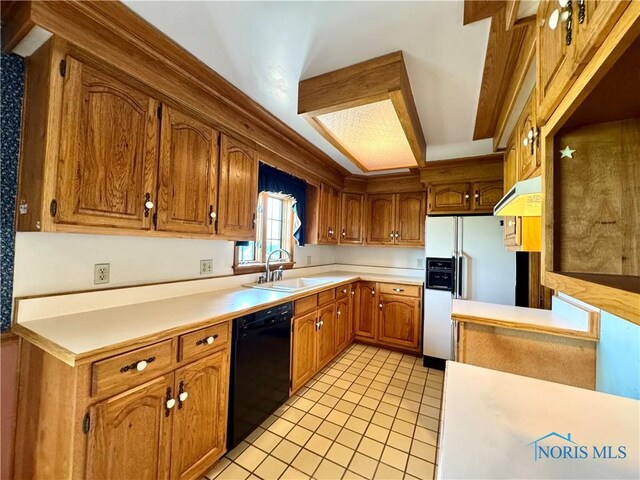 1965 Colwell Cir, Defiance, OH 43512 - kitchen with a sink, white refrigerator with ice dispenser, dishwasher, under cabinet range hood, and light tile patterned floors
