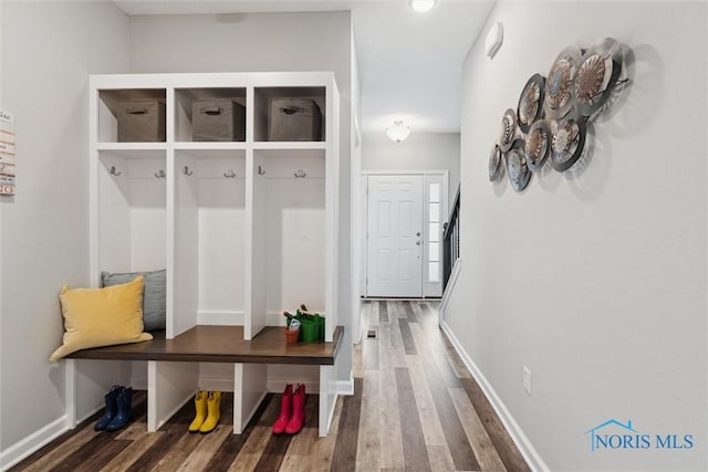mudroom with baseboards and wood finished floors