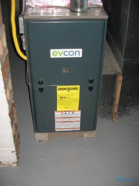 utility room with heating unit