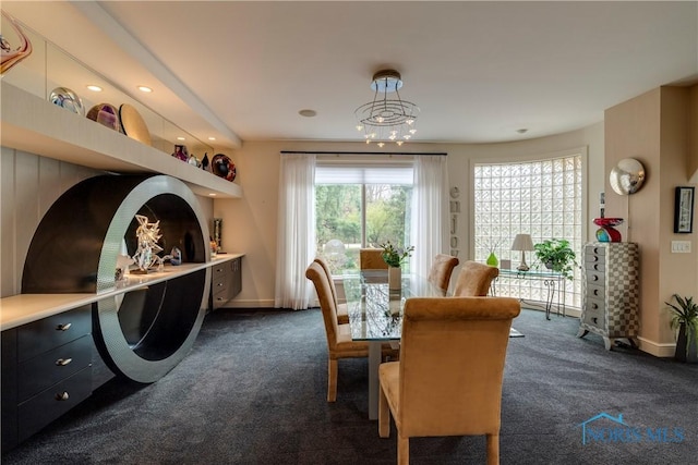 dining room with baseboards and dark carpet