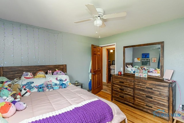bedroom with wood finished floors and ceiling fan