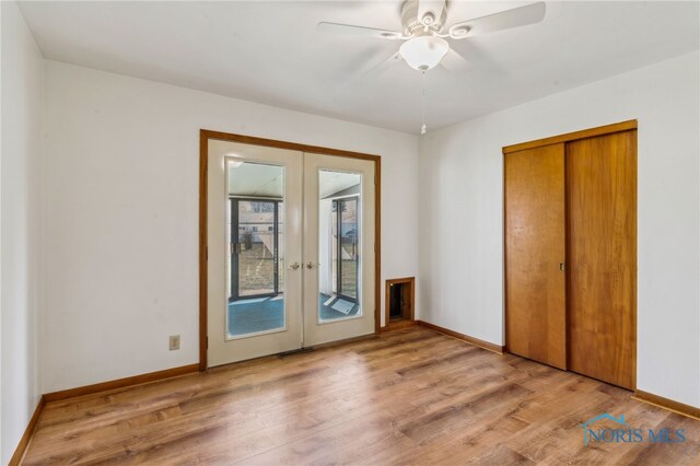 1314 Stoner Rd, Fostoria, OH 44830 - unfurnished bedroom featuring baseboards, french doors, access to exterior, and light wood finished floors
