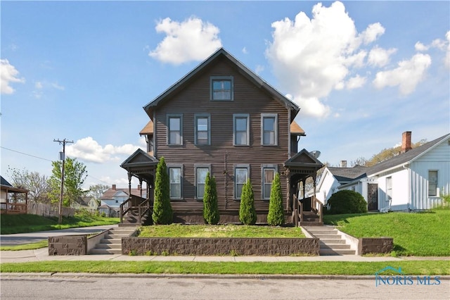 666 Humboldt St, Toledo, OH 43604 - view of front facade with stairs and a front lawn
