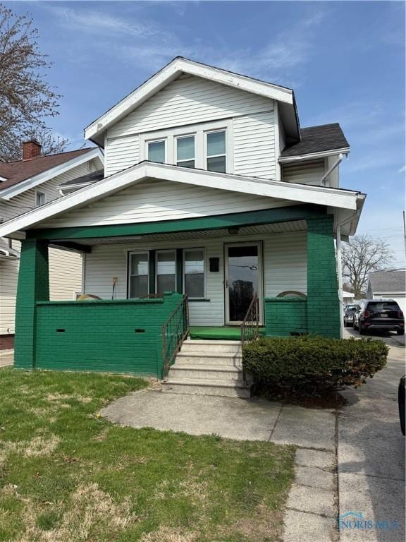 3250 Otto St, Toledo, OH 43608 - view of front of home featuring a porch and brick siding