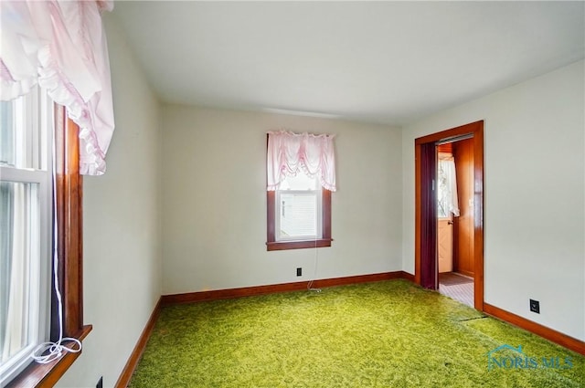 806 W Tiffin St, Fostoria, OH 44830 - carpeted spare room with baseboards