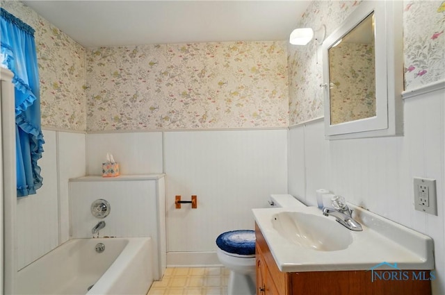 806 W Tiffin St, Fostoria, OH 44830 - bathroom featuring a tub to relax in, wallpapered walls, vanity, and wainscoting