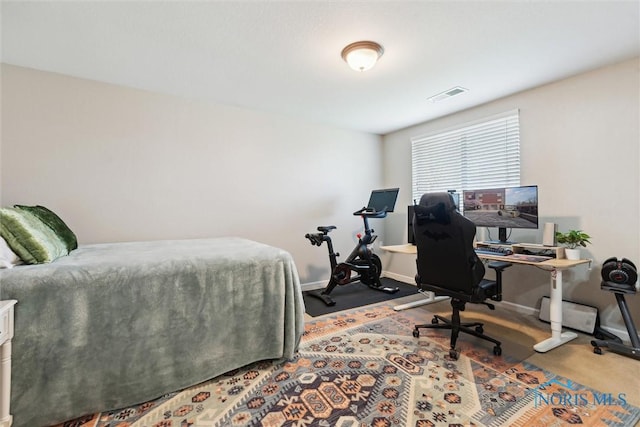 carpeted bedroom with baseboards and visible vents