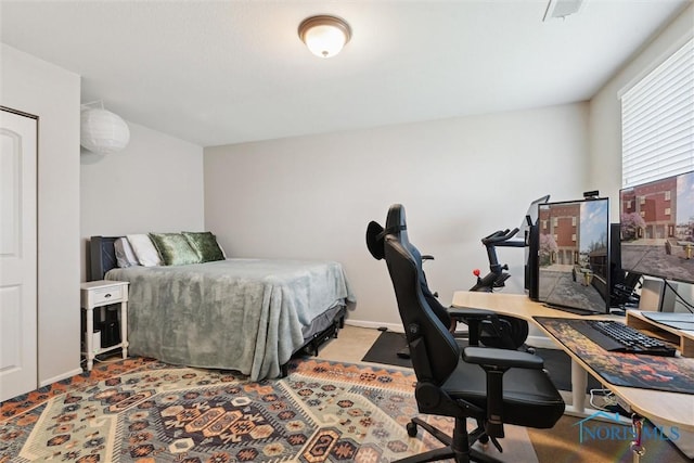 carpeted bedroom with baseboards