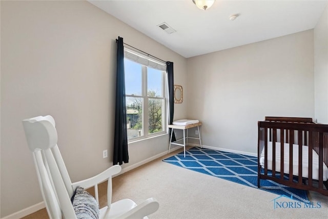 carpeted bedroom with baseboards and visible vents