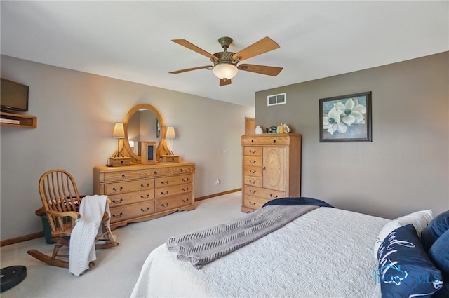 bedroom featuring baseboards, a ceiling fan, visible vents, and carpet