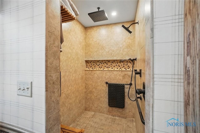 bathroom featuring tiled shower