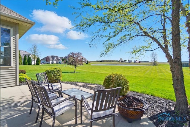 view of patio / terrace featuring an outdoor fire pit