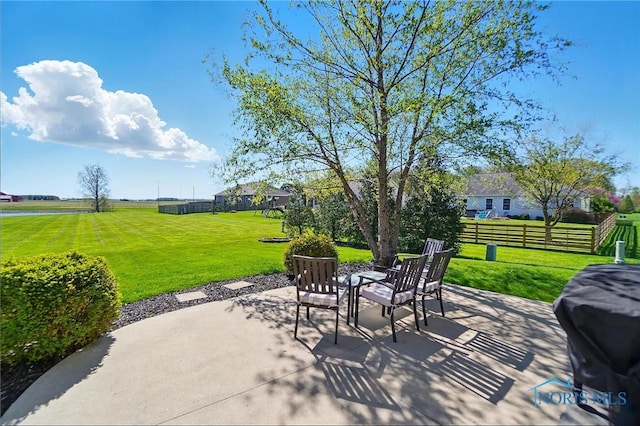 view of patio / terrace featuring fence