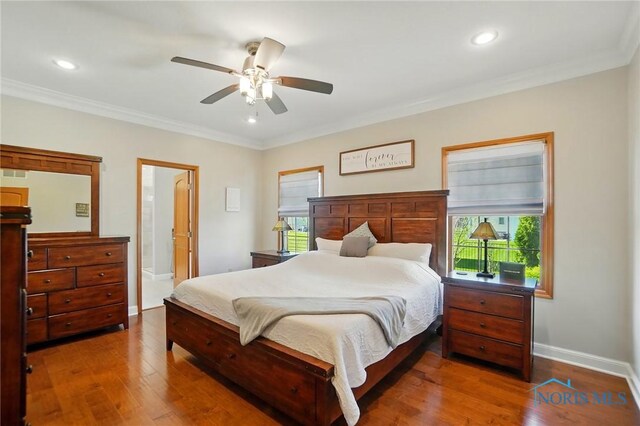 bedroom with recessed lighting, baseboards, ornamental molding, and wood finished floors