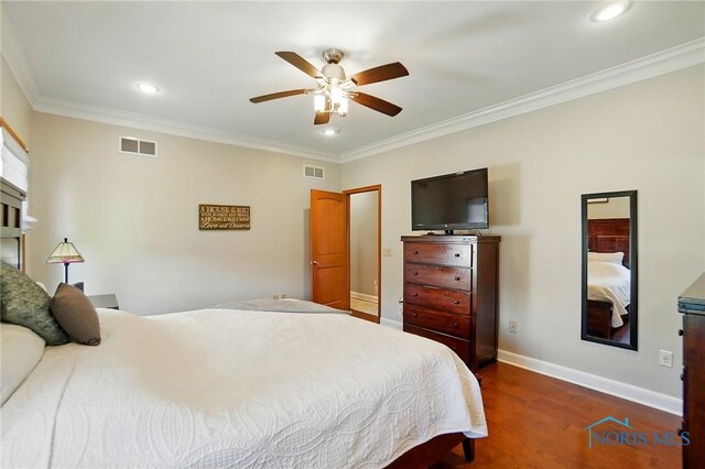 bedroom featuring crown molding, recessed lighting, visible vents, and dark wood finished floors