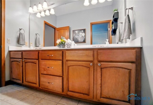 bathroom featuring double vanity and tile patterned floors