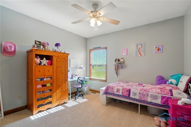 carpeted bedroom with baseboards and ceiling fan