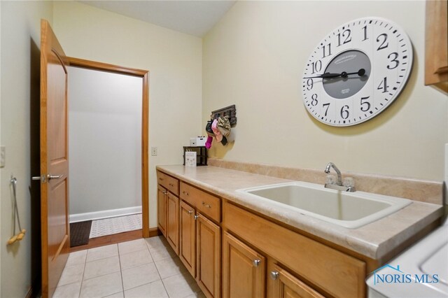 bathroom featuring tile patterned floors and vanity