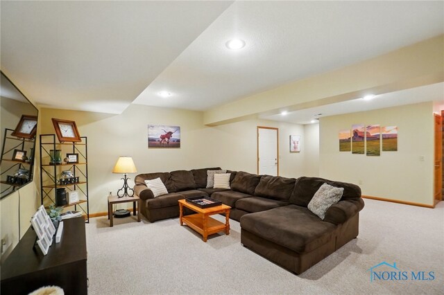 living room with recessed lighting, baseboards, and carpet
