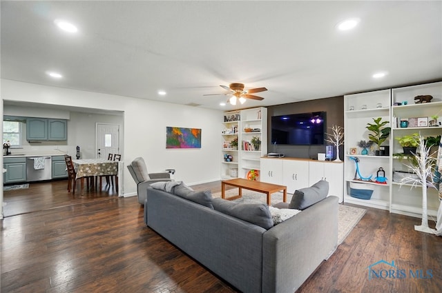 living room with recessed lighting, a ceiling fan, and dark wood-style flooring