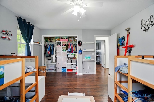 bedroom with a ceiling fan, a closet, and wood finished floors