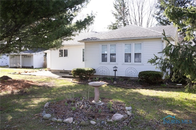 306 Lincoln St, Lyons, OH 43533 - view of front facade with a front lawn and roof with shingles