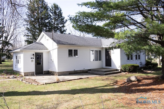 306 Lincoln St, Lyons, OH 43533 - view of front of property featuring a patio area, roof with shingles, and a front lawn