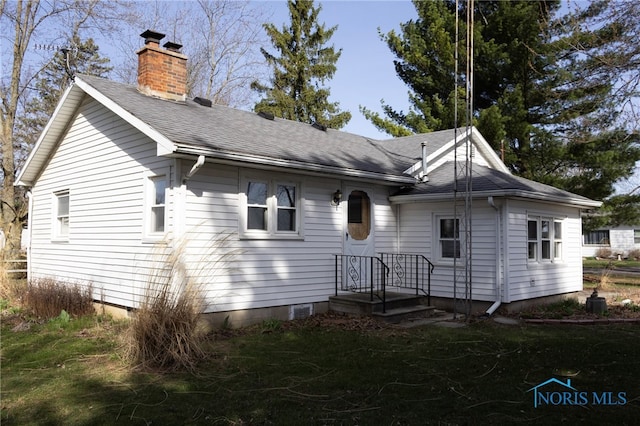 306 Lincoln St, Lyons, OH 43533 - view of front of house with roof with shingles and a chimney