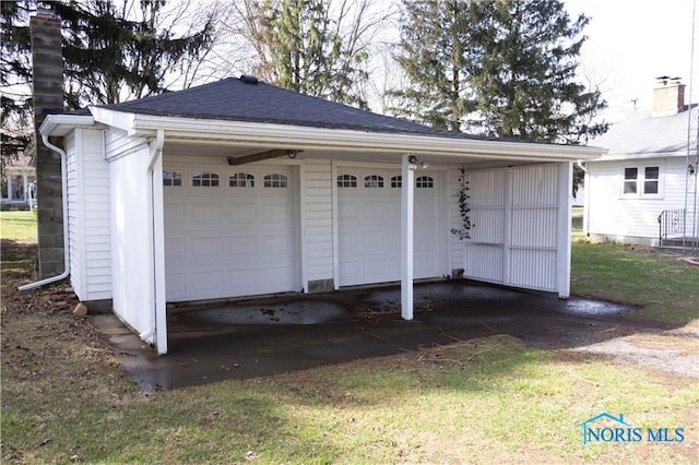 306 Lincoln St, Lyons, OH 43533 - view of property's community featuring an outdoor structure and a detached garage