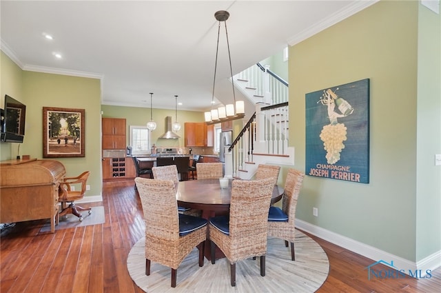 dining space with recessed lighting, dark wood-style flooring, stairway, baseboards, and ornamental molding