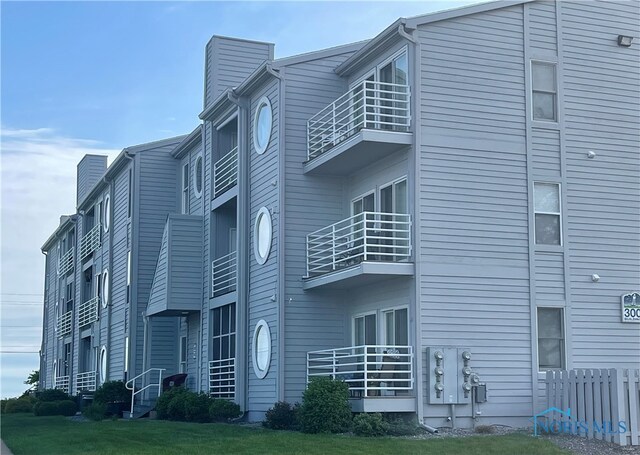 view of building exterior featuring fence