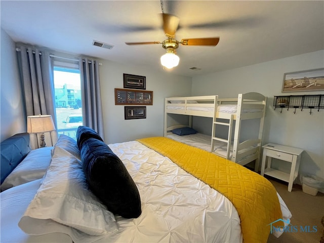 bedroom featuring a ceiling fan and visible vents