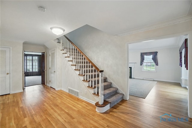 160 Winfield Dr, Bowling Green, OH 43402 - staircase with baseboards, wood finished floors, visible vents, and ornamental molding