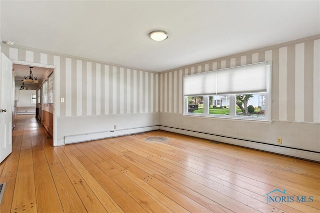 325 Park St, Bryan, OH 43506 - unfurnished room with wallpapered walls, hardwood / wood-style floors, and plenty of natural light
