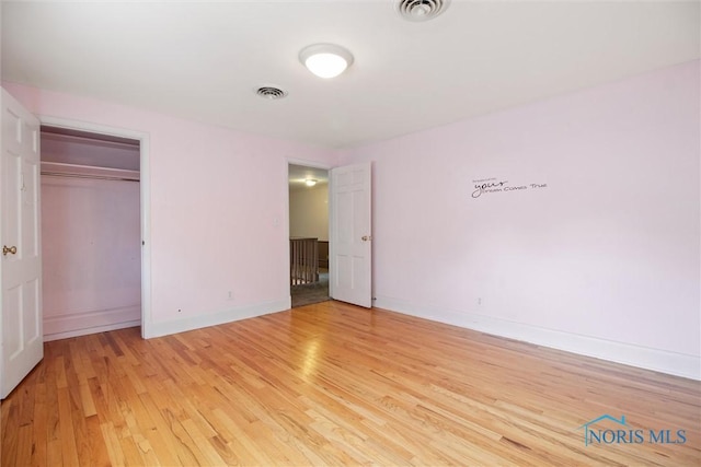 325 Park St, Bryan, OH 43506 - unfurnished bedroom featuring light wood-type flooring, baseboards, and a closet