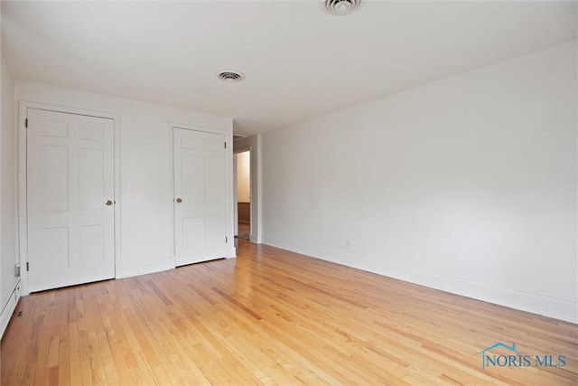 325 Park St, Bryan, OH 43506 - unfurnished bedroom featuring light wood-type flooring and baseboards