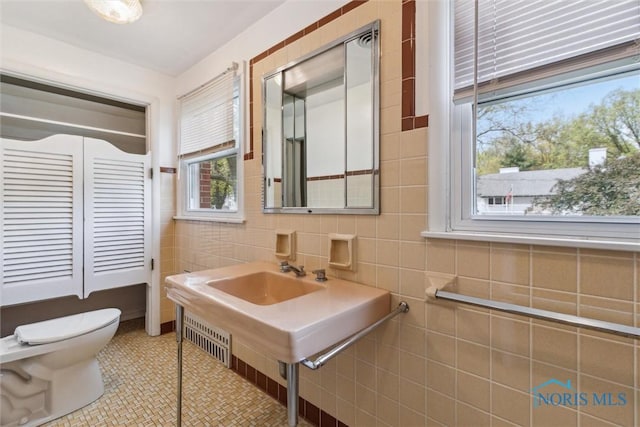 325 Park St, Bryan, OH 43506 - bathroom with toilet and tile walls