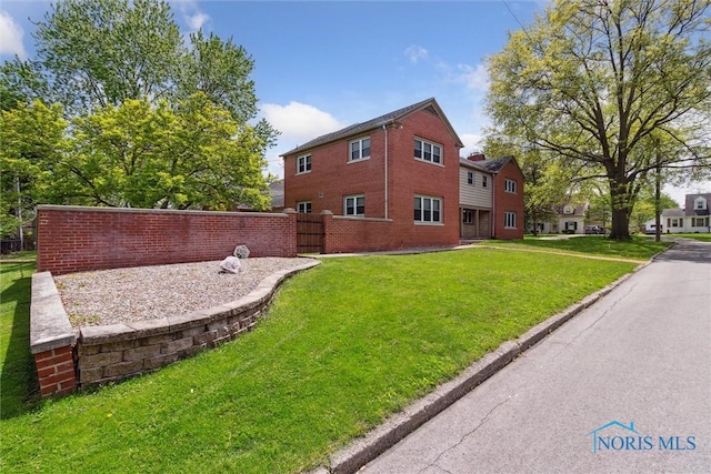 325 Park St, Bryan, OH 43506 - view of home's exterior featuring brick siding