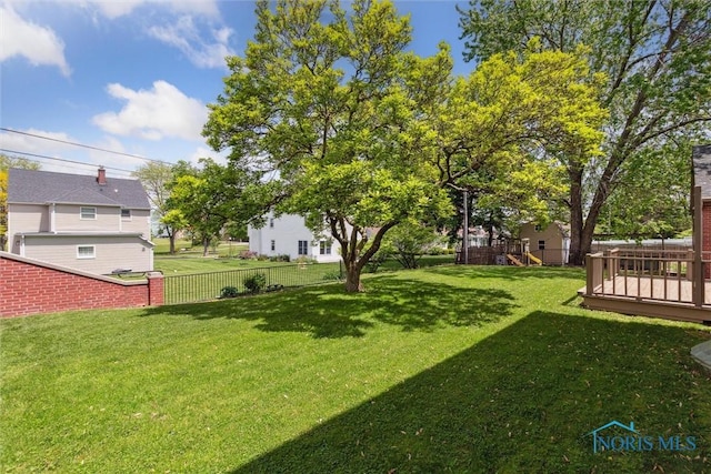 325 Park St, Bryan, OH 43506 - view of yard featuring a wooden deck and a playground