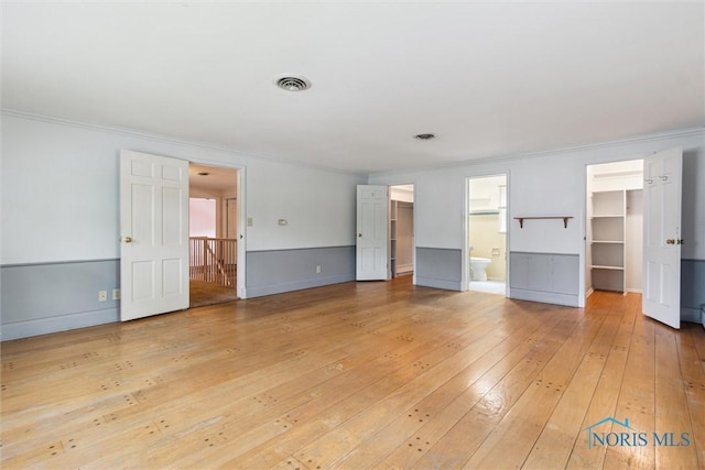 325 Park St, Bryan, OH 43506 - unfurnished living room with light wood finished floors and ornamental molding