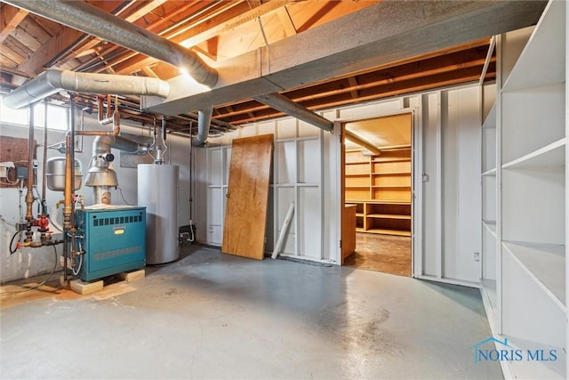 325 Park St, Bryan, OH 43506 - unfinished below grade area featuring water heater and a heating unit