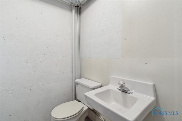 325 Park St, Bryan, OH 43506 - half bathroom featuring a sink and toilet