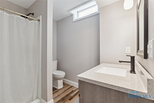 4218 Herdmans Cir, Maumee, OH 43537 - full bath featuring vanity, toilet, wood finished floors, and a shower with curtain