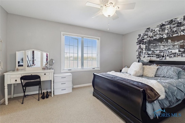 bedroom with baseboards, ceiling fan, and light carpet