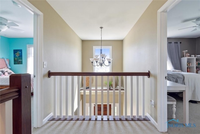 4218 Herdmans Cir, Maumee, OH 43537 - stairway with ceiling fan, carpet floors, a chandelier, and baseboards