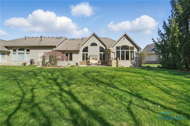 3862 Ravine Hollow Ct, Maumee, OH 43537 - back of house with a lawn and a patio