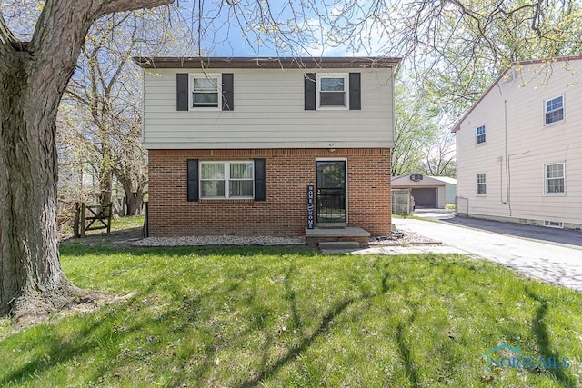 853 Circleview Dr, Toledo, OH 43615 - colonial inspired home featuring brick siding, an outdoor structure, and a front yard