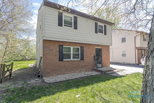 853 Circleview Dr, Toledo, OH 43615 - colonial inspired home featuring a front lawn and brick siding