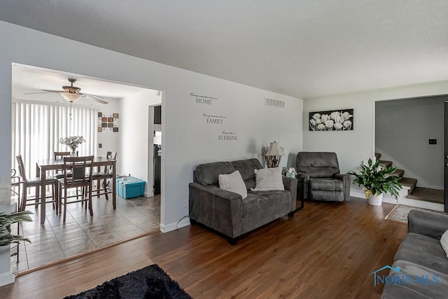 853 Circleview Dr, Toledo, OH 43615 - living area with baseboards, a ceiling fan, wood finished floors, and visible vents