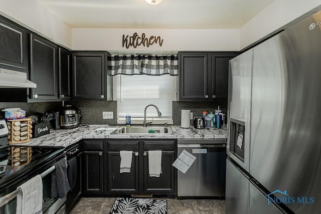 853 Circleview Dr, Toledo, OH 43615 - kitchen with a sink, dark cabinetry, stainless steel appliances, and under cabinet range hood